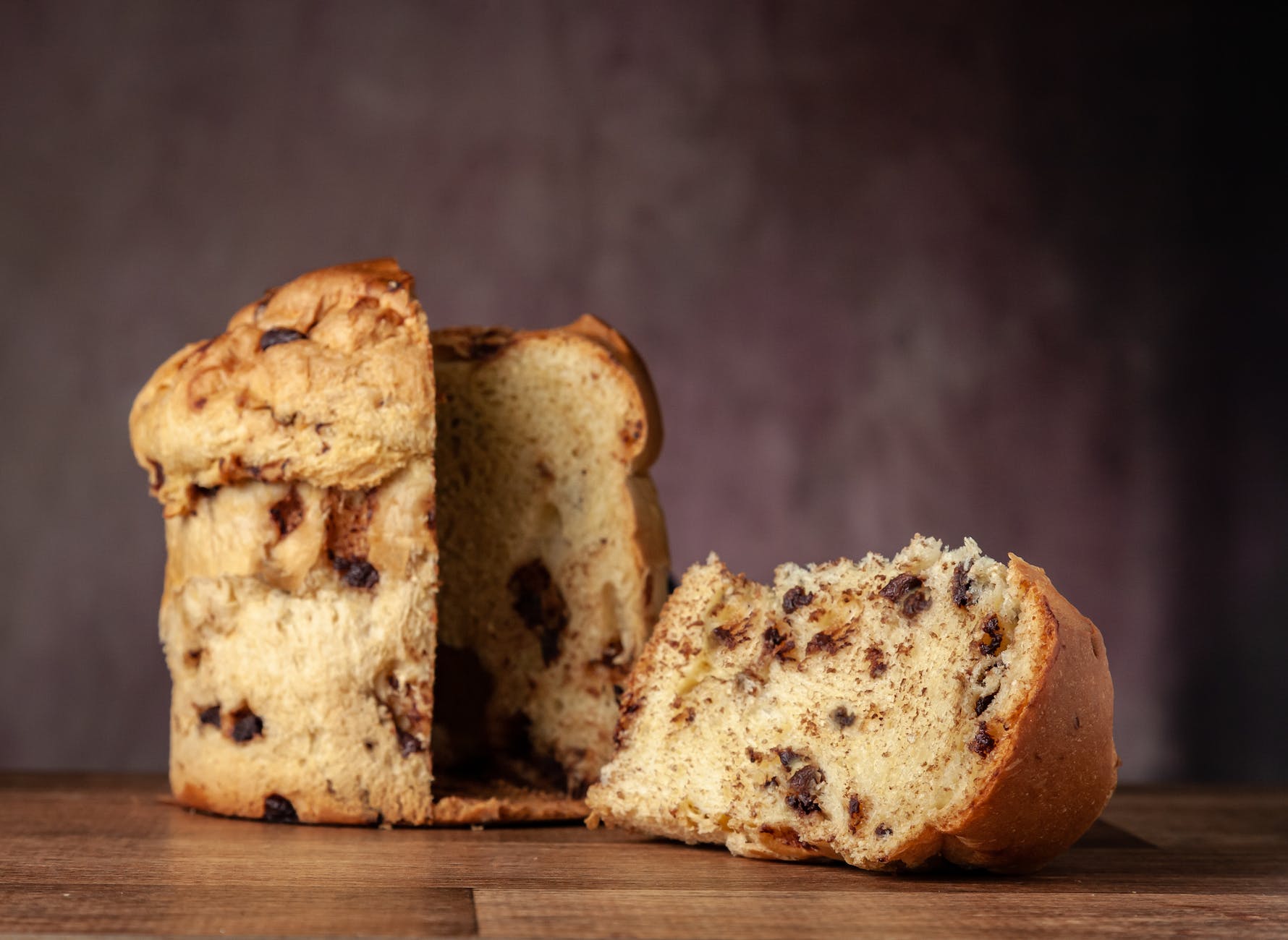 close up photo of brown bread on wooden table