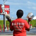 preacher standing with books