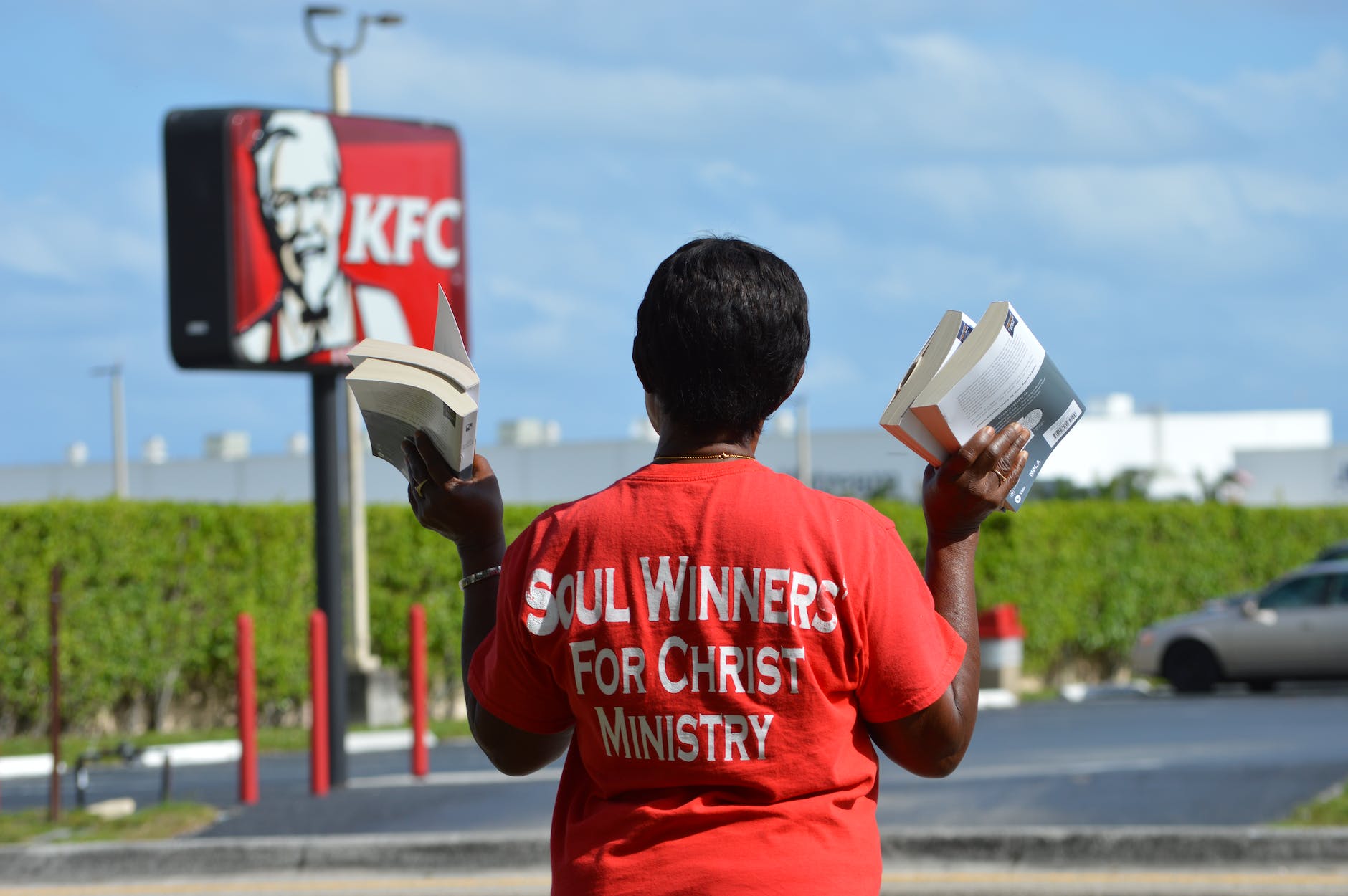 preacher standing with books