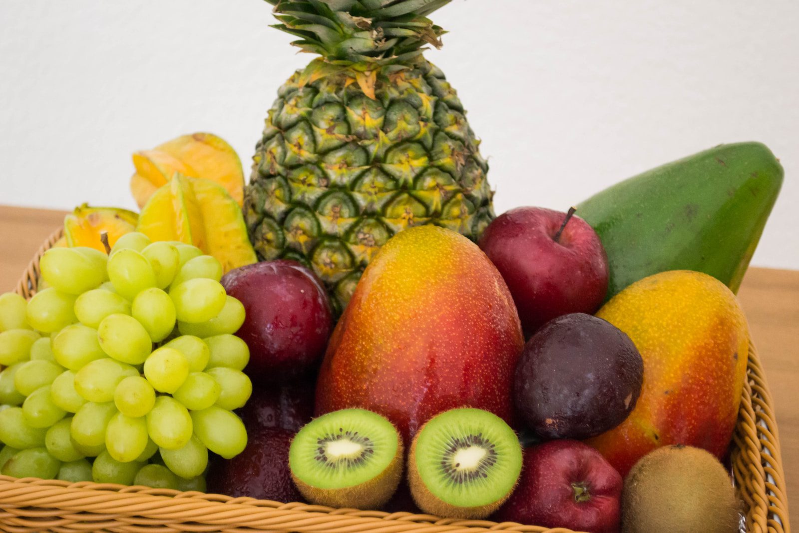 assorted fruits on brown woven basket