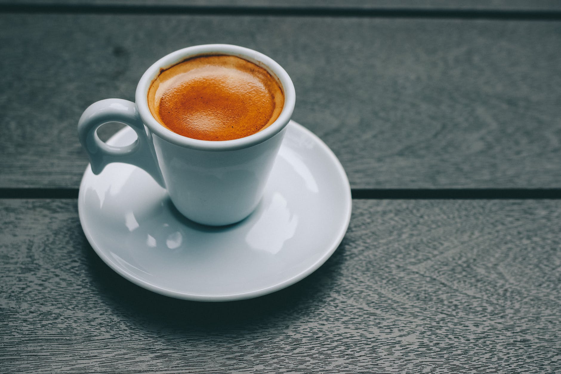 white ceramic mug and saucer