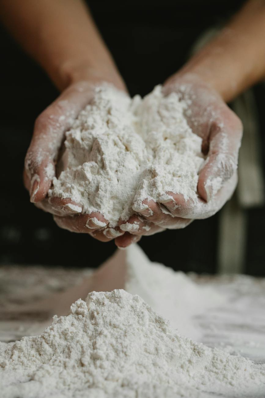 woman showing wheat flour in hands