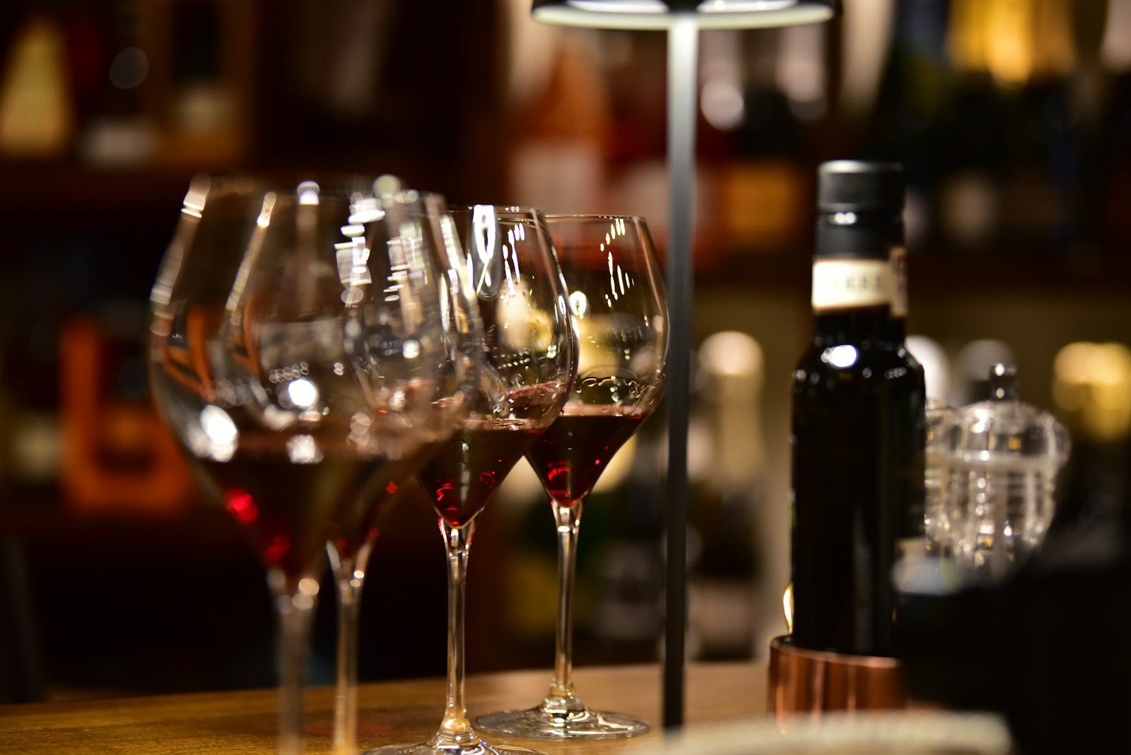 clear wine glass on brown wooden table