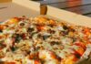 pizza on white cardboard box